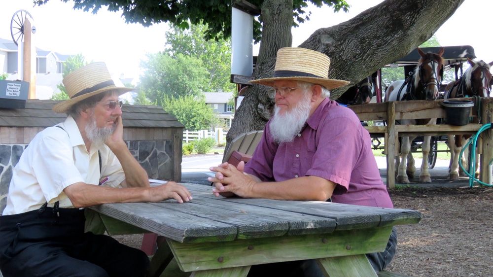 
Melvin 77, left, and Aaron, 70 discuss the elections. Aaron said he does not approve  of Trump being a casino owner . 'We're not like the Baptists or the Lutheran folks. They might tell him what to do … we are not going to tell you what to do' [Jessica Sarhan/Al Jazeera]
