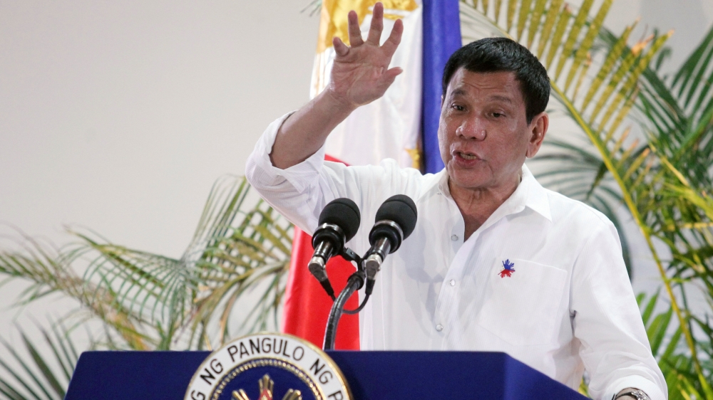 Philippine President Rodrigo Duterte gestures while answering questions during a news conference in Davao city