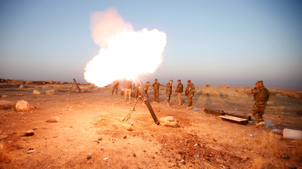 Peshmerga forces fires a mortar towards Islamic state militants'' positions in the town of Naweran near Mosul [REUTERS]