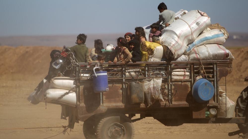 People that fled ISIL-controlled areas arrive at a rebel controlled area in northern Aleppo countryside, Syria [REUTERS]