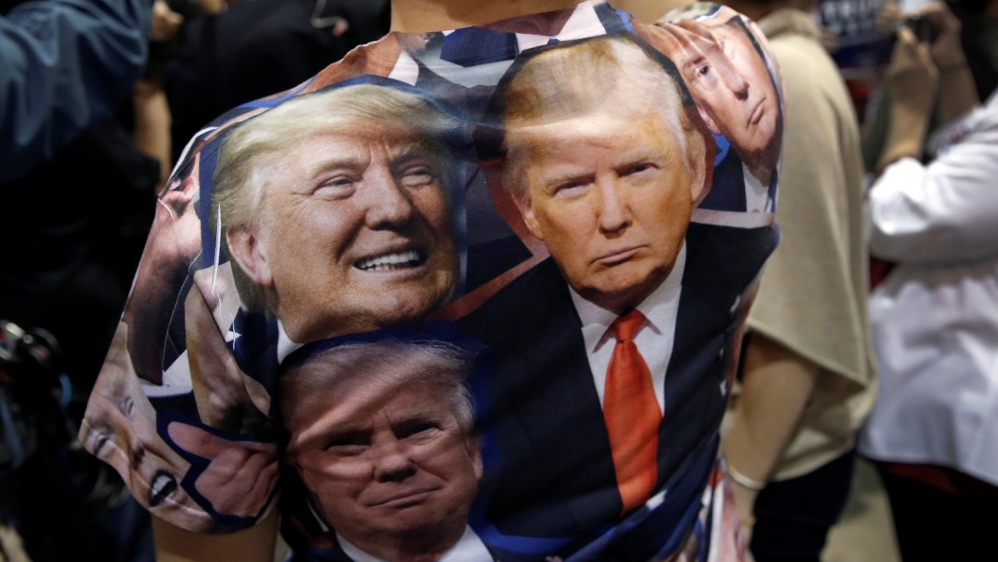 A supporter of Republican presidential nominee Donald Trump attends a campaign rally in Nevada [Reuters]