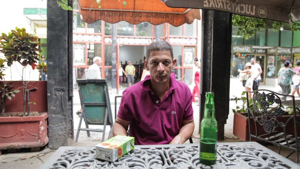 Arami Yosik, a labourer from Guantanamo, earns $60 a month - the same sum as the country's celebrated doctors - for working on the Manzana de Gomez [Ed Augustin/Al Jazeera]