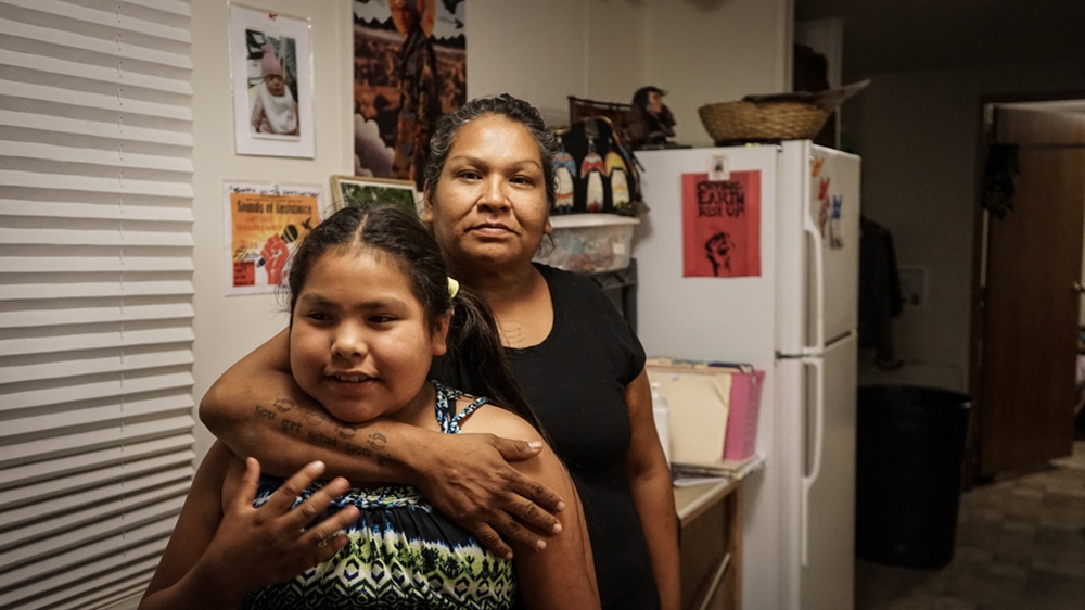 Olowan says she struggled with alcoholism for years before eventually giving it up 11 years after her mother's death  [Patrick Strickland/Al Jazeera] 