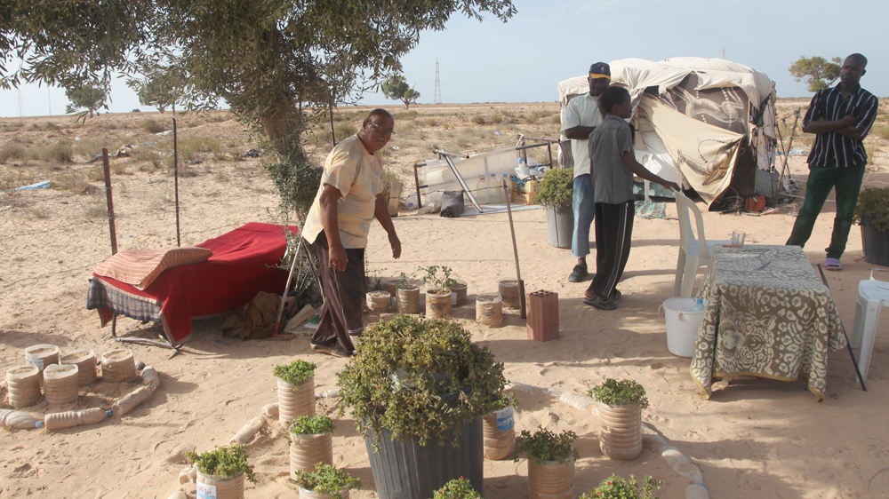 Ali Ali, pictured left, says he has tried to commit suicide twice [Thessa Lageman/Al Jazeera] 