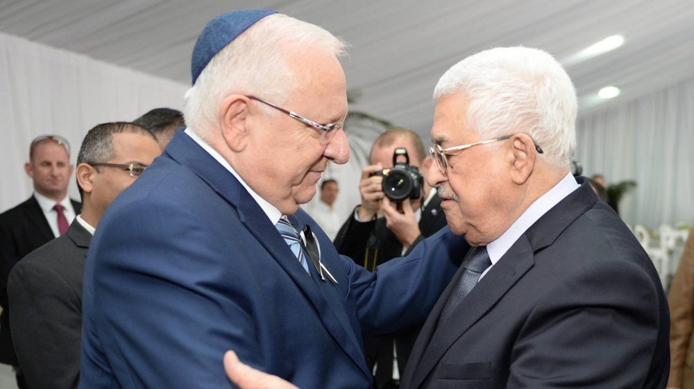 Israeli President Reuven Rivlin meeting with Palestinian President Mahmoud Abbas during the burial ceremony at the funeral of Shimon Peres [EPA]