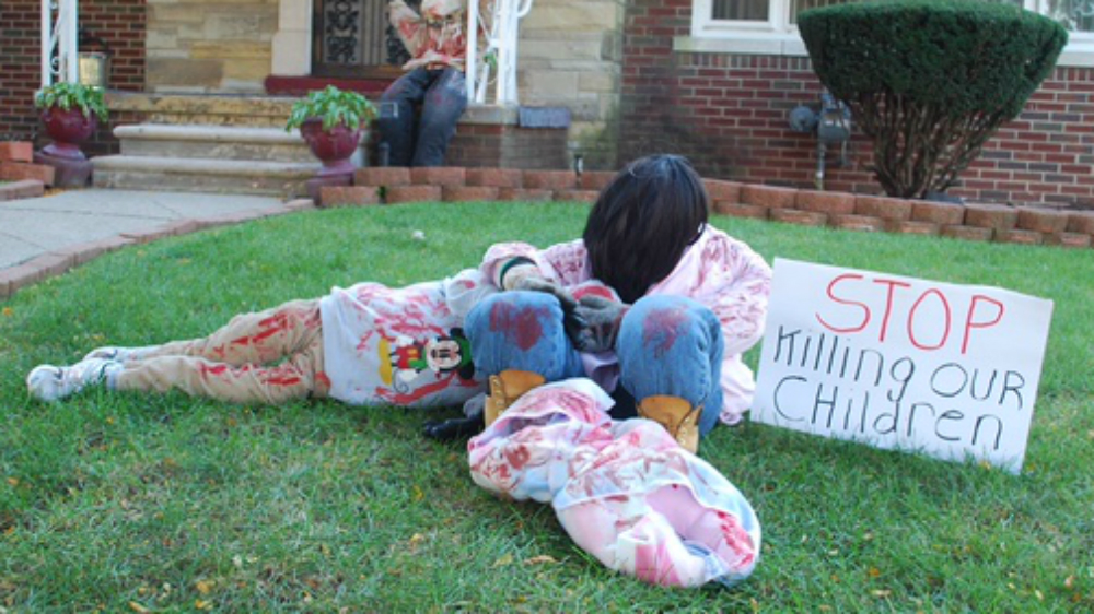 A question from Haddon's granddaughter inspired the installation of children dying [Kurt Nagl/Al Jazeera]