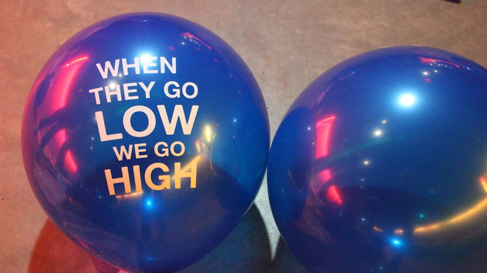 Blue balloons read what Michelle Obama said at the Democratic Convention in July: