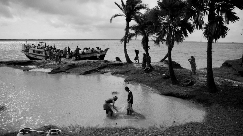  Ghoramara island is known as the 'sinking island'. Located 150km south of Kolkata in the Bay of Bengal's Sunderban delta, the island, once spanning more than 20 sq km, has been reduced to an area of just 5sq km.  Global warming has caused the river to grow. Flowing down from the mighty Himalayas, the river brings more and more snowmelt along as it empties into the Bay of Bengal. High tides and floods play havoc on the fragile embankments, displacing hundreds of islanders every year. [Swastik Pal/Al Jazeera] 