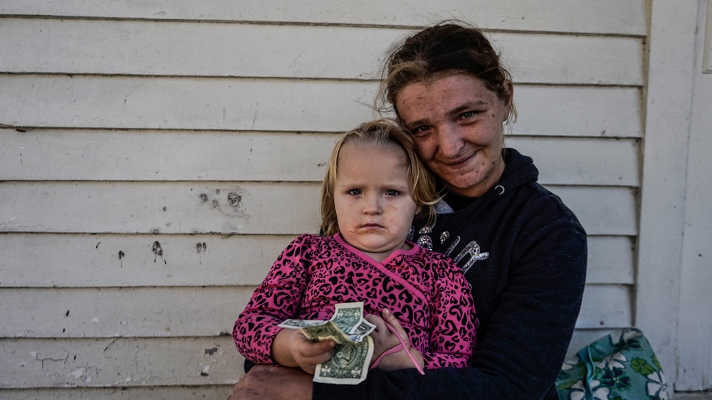 
Single mother of three, Katie Bennett, says food stamps only last until the middle of the month [Shaghayegh Tajvidi/Al Jazeera]
