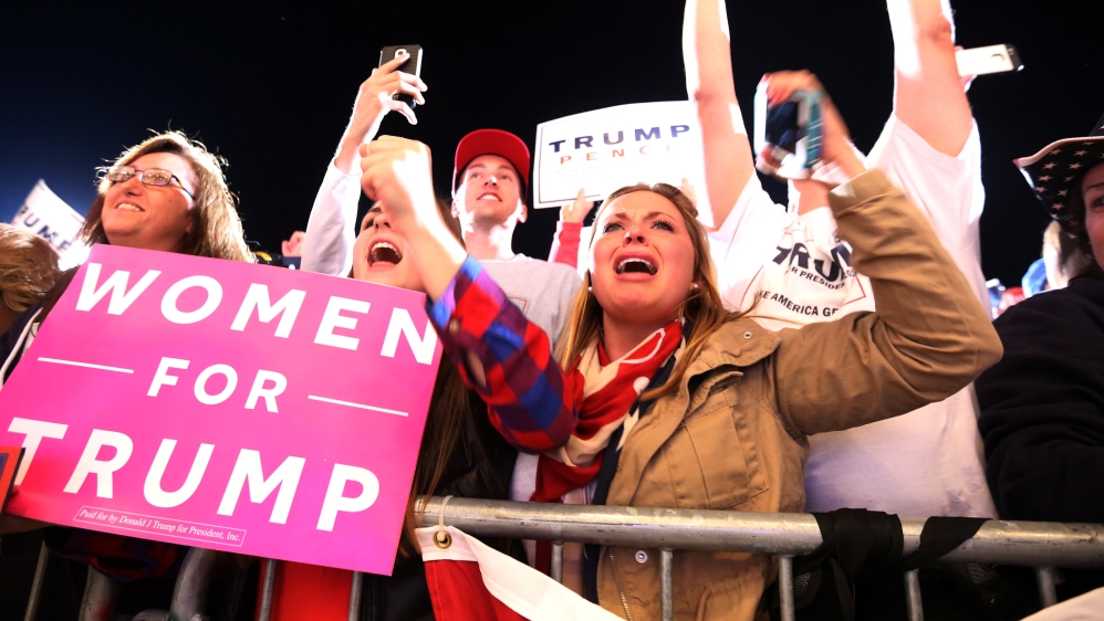 Supporters cheer as Republican presidential nominee Donald Trump speaks at a campaign event in Iowa [Carlo Allegri/Reuters]