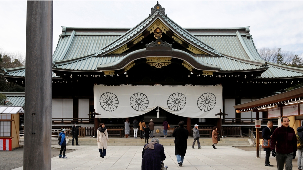Visitors walk at the Yasukuni Shrine in Tokyo