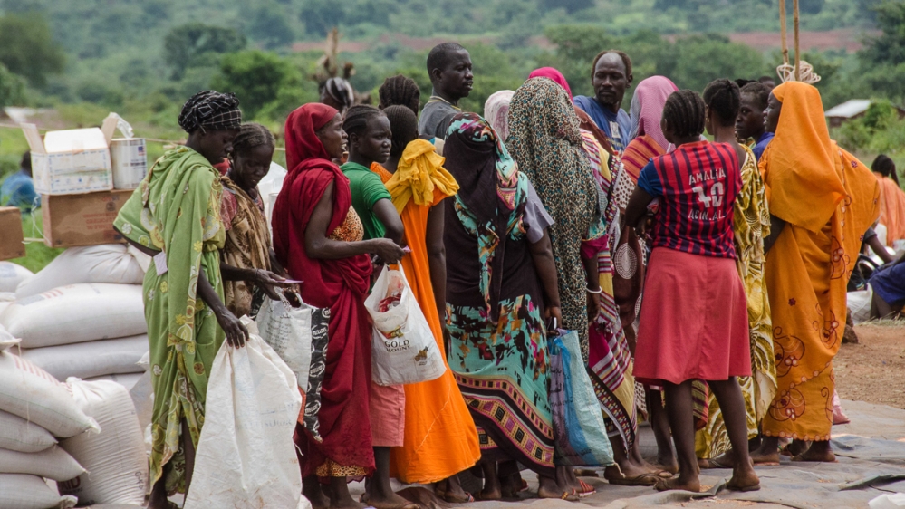 Aid delivery to internally displaced at UNMISS base, Wau [Richard Nield/Al Jazeera]