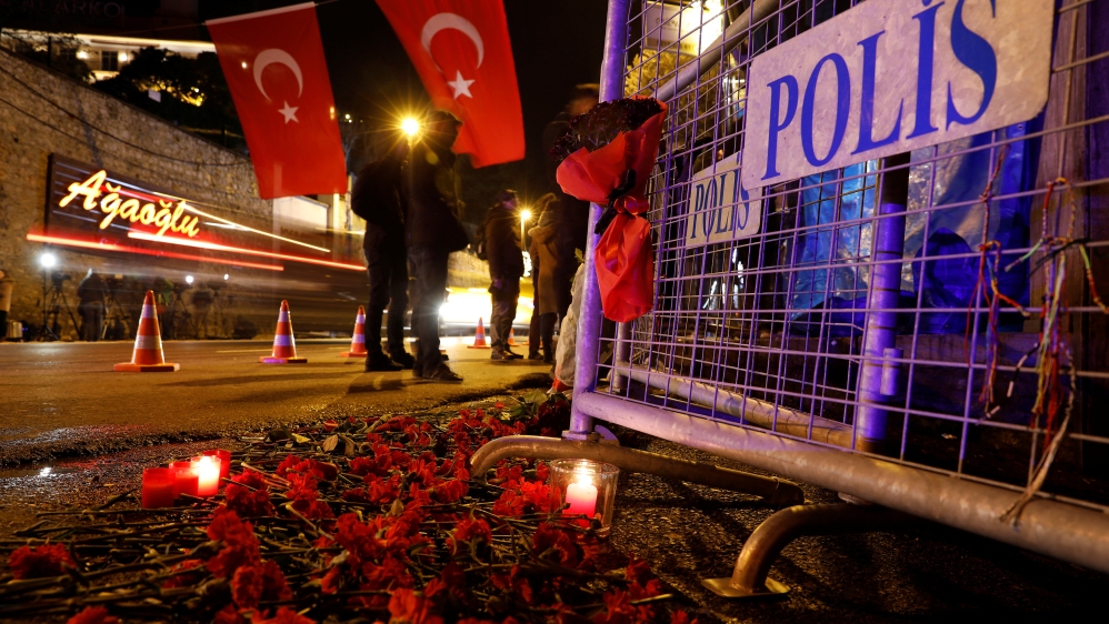 Flowers are placed near the entrance of Reina nightclub by the Bosphorus, which was attacked by a gunman, in Istanbul