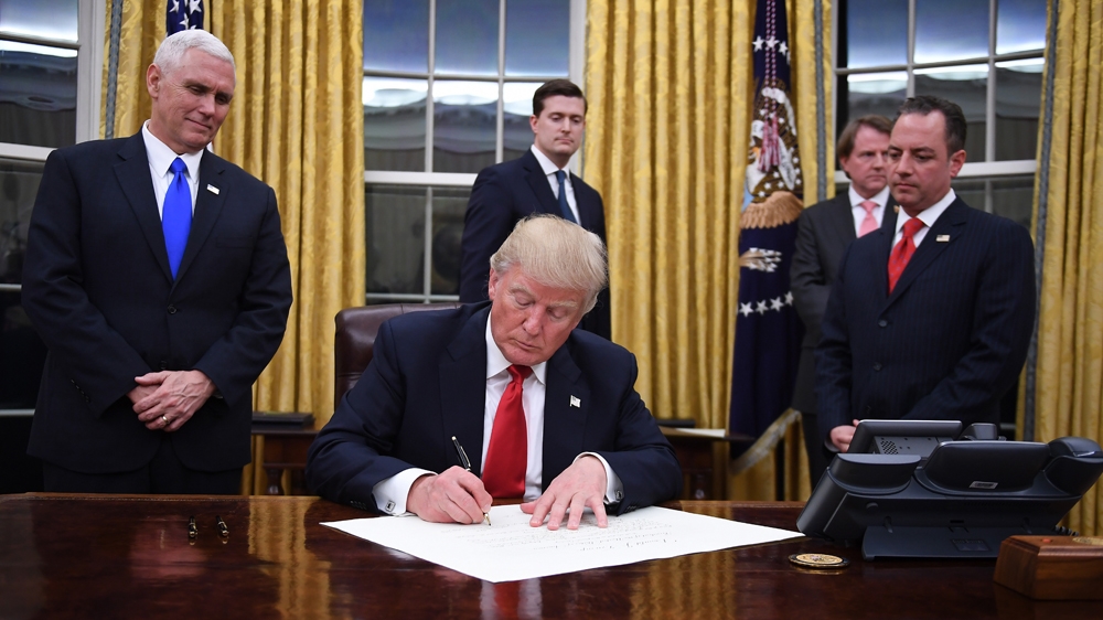 US President Donald Trump signs an executive order