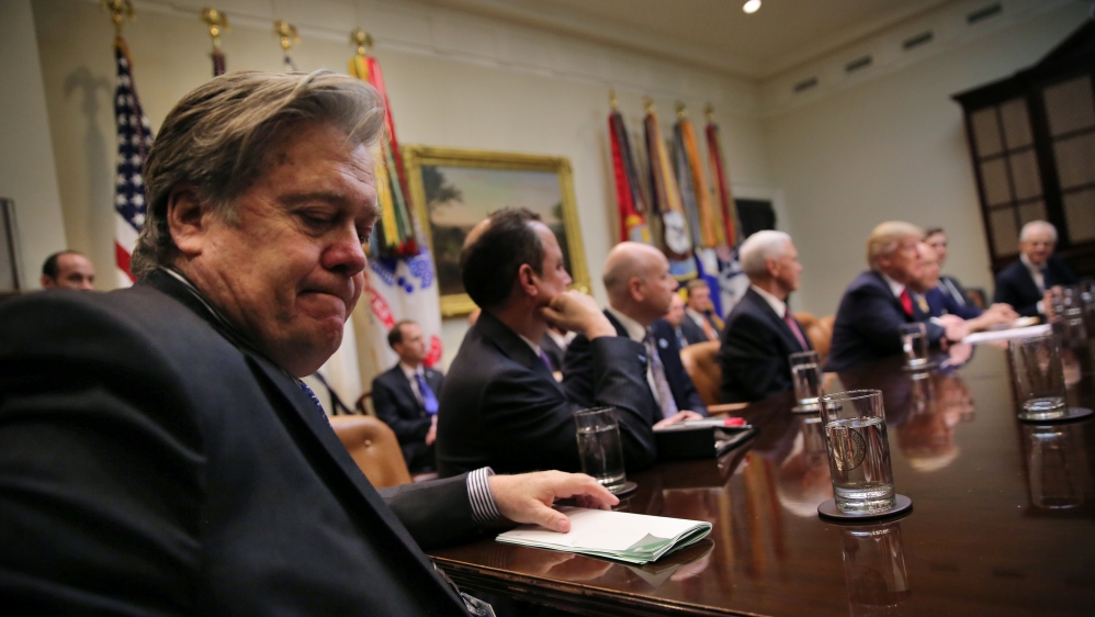 White House Chief Strategist Stephen Bannon (L) attends a meeting between U.S. President Donald Trump and congressional leaders to discuss trade deals at the at the Roosevelt room of the White House