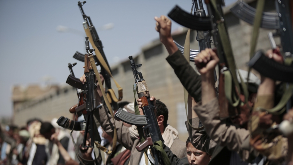 Tribesmen loyal to Houthi rebels hold their weapons in Sanaa in 2016