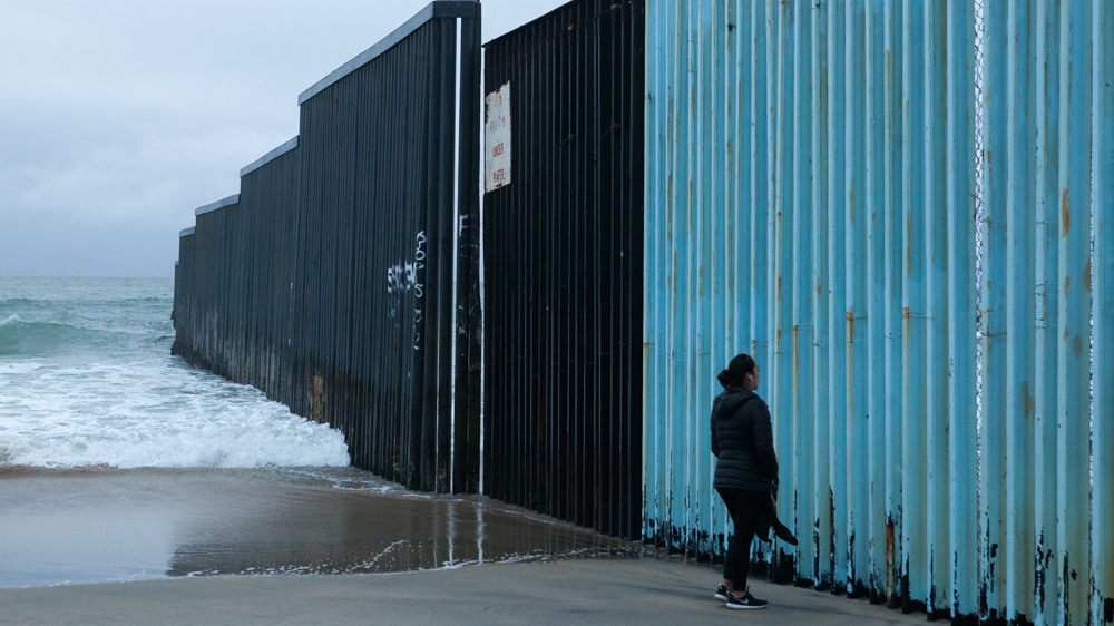 The US-Mexico border wall as seen from Playas de Tijuana in Mexico [Jessica Chou/Al Jazeera] 