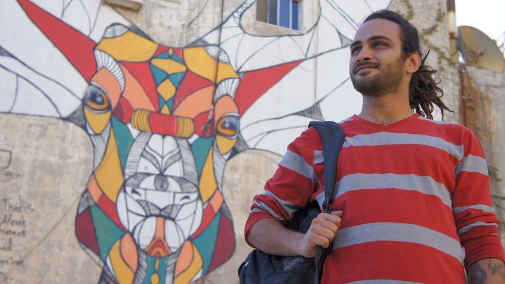 Attar painted his first large-scale mural, a massive geometric deer, in the Jabal Al Weibdeh area [Zab Mustefa/Al Jazeera]