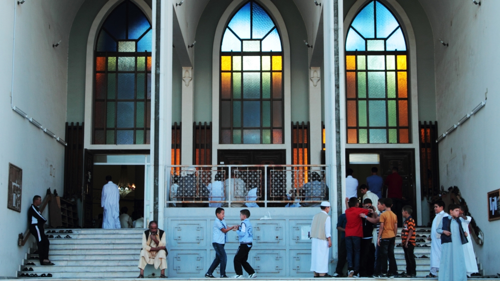  Looking out my window I see everyday life continuing, with its busy shops, heavy traffic ...  [Gaia Anderson/AP]