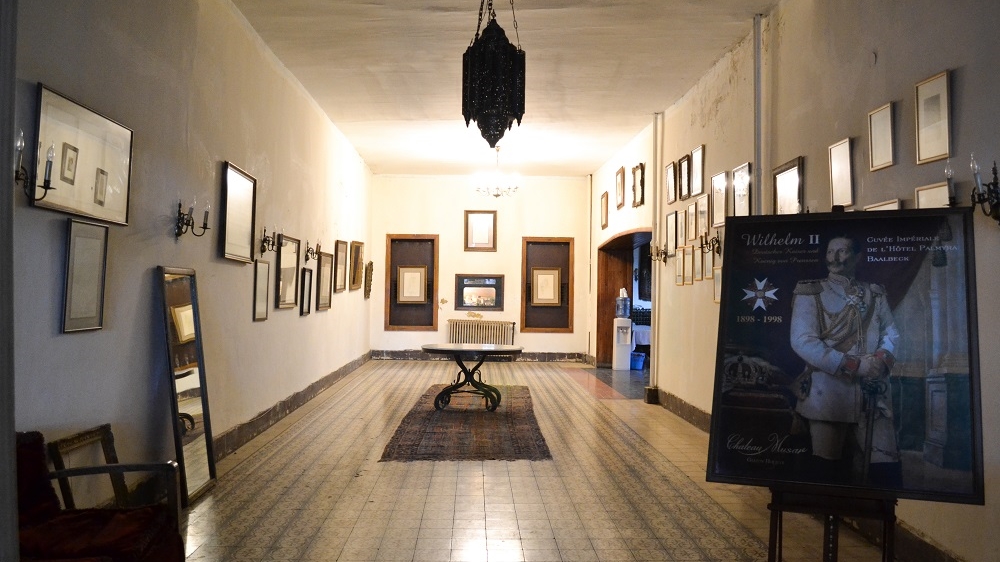 The hotel's entrance has a picture of Kaiser Wilhelm II, reminiscent of his stay there in 1898 [India Stoughton/Al Jazeera]