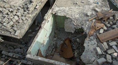 Khalaf's neighbour's home was partially destroyed by the air strike [Joao Castellano/Al Jazeera] 