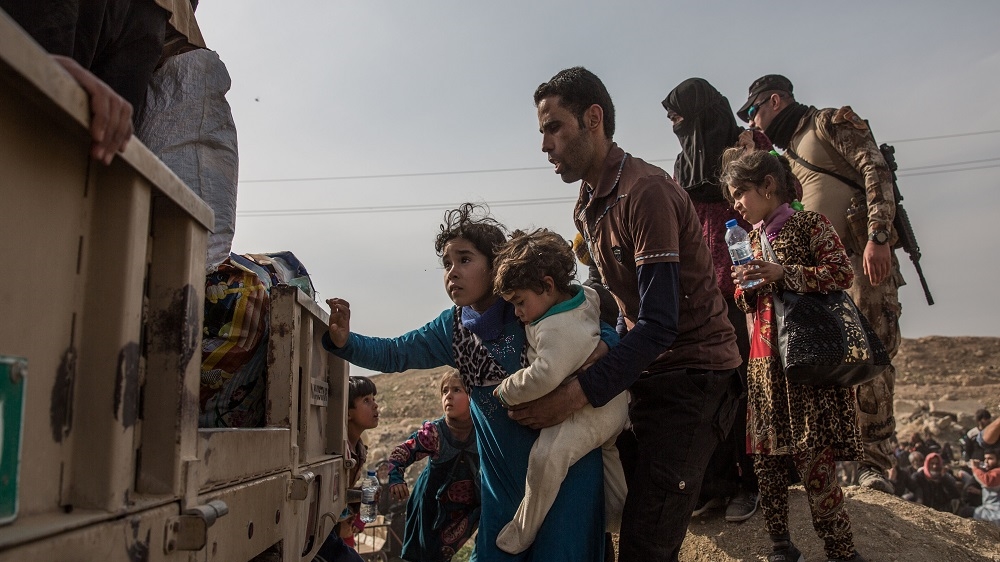 The Hassans say they were targeted because ISIL knew that Tarik's cousin was a member of Iraq's national intelligence service [John Beck/Al Jazeera]