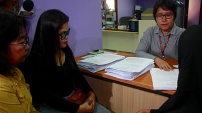 The families of three men killed last year file murder charges against the perpetrators before the Office of the Ombudsman in Quezon City [Brennan Weiss/Al Jazeera]