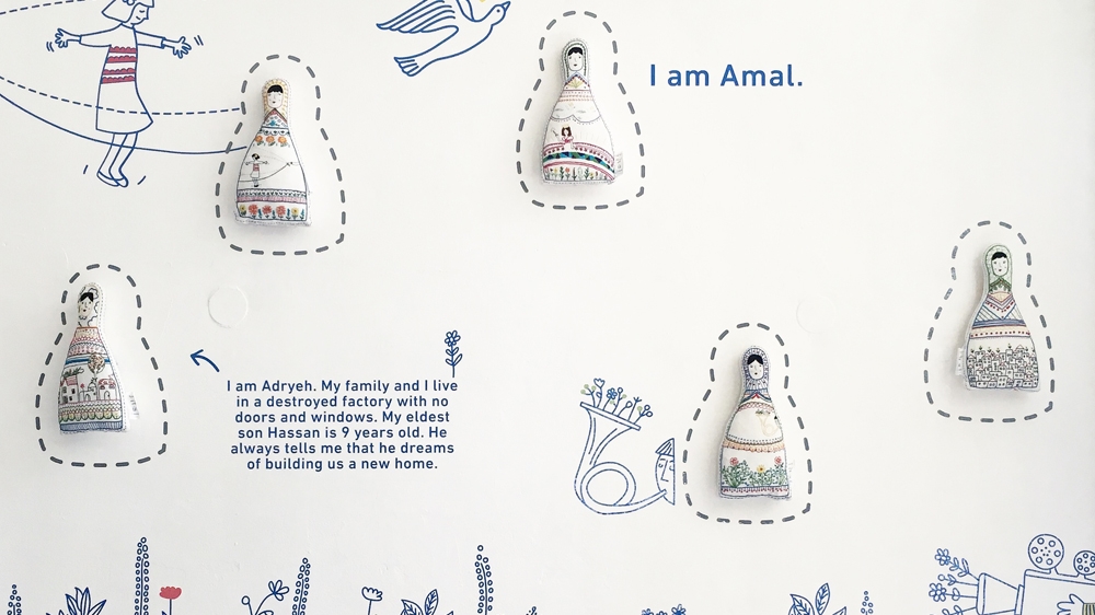 Adryeh and her family live in a derelict factory with no windows or doors. Her nine-year-old son, Hassan, dreams of rebuilding their home one day [Courtesy of the Ana Collection/Al Jazeera]