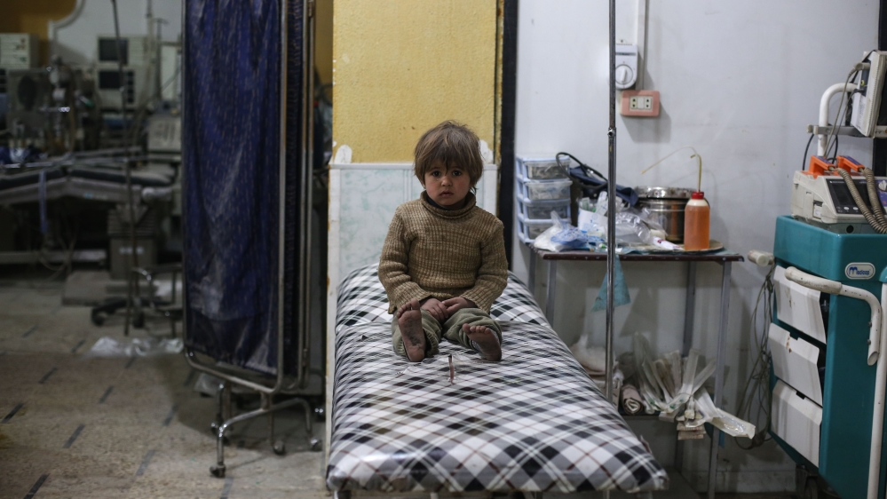 Injured poeple receive treatment after bombing Douma