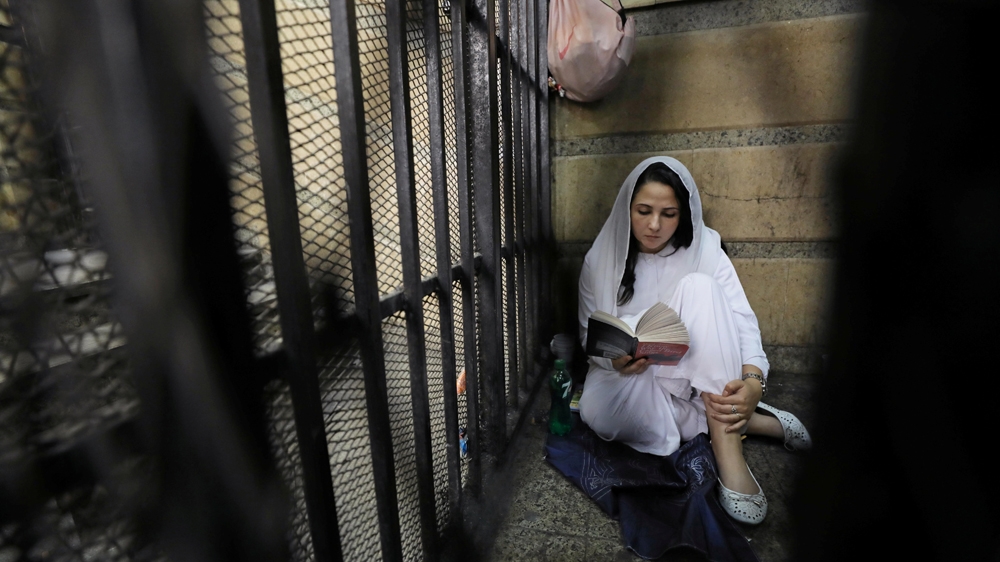 Aya Hijazi, founder of a non-governmental organisation that looks after street children, reading in prison