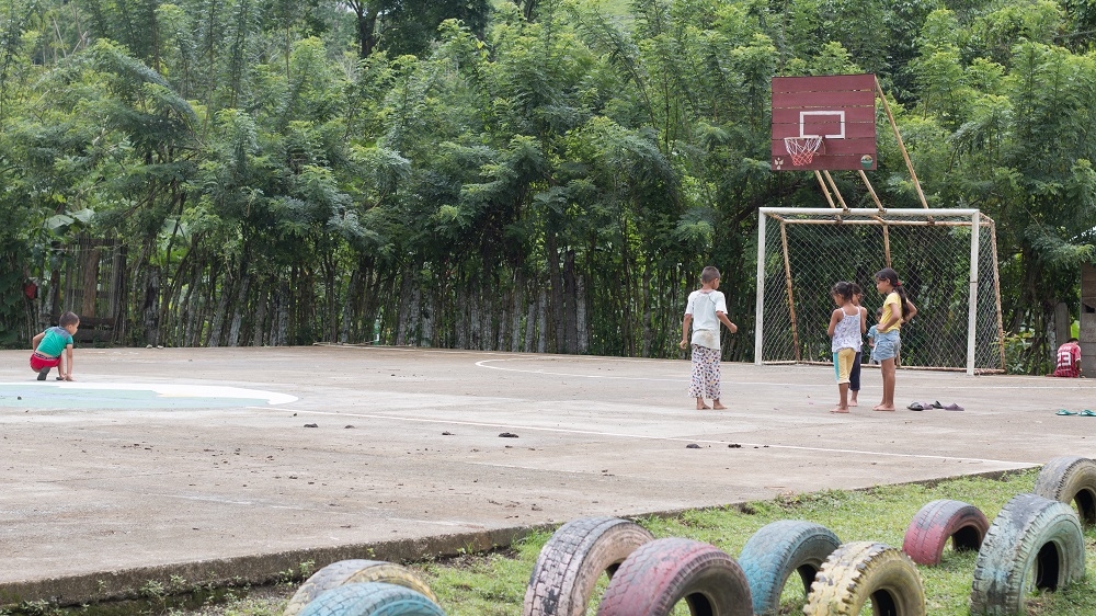 Children play on the communal soccer pitch. Tournaments are held every weekend in the community [Joe Parkin Daniels/Al Jazeera]