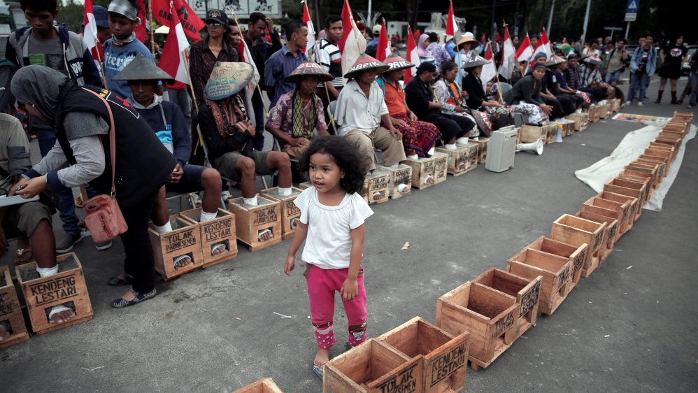 Cement companies say factories will help develop impoverished region [Beawiharta/Reuters]