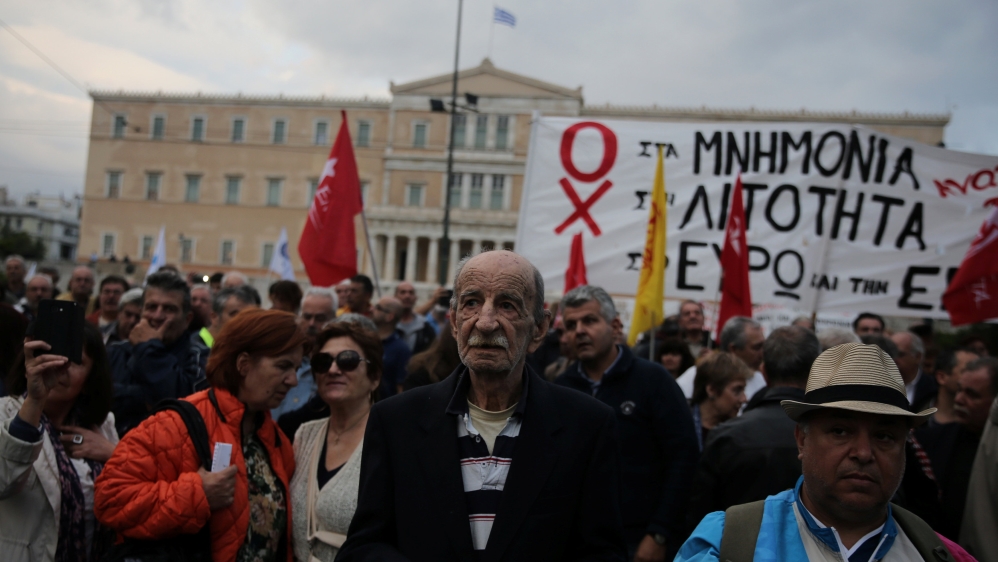 Demonstrators are gathered outside the parliament building as Greek lawmakers vote on the latest round of austerity Greece has agreed with its lenders, in Athens