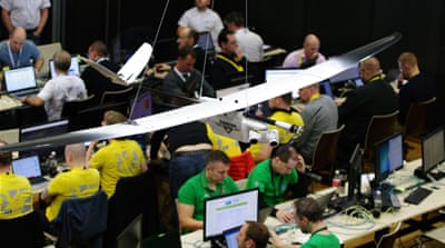 A drone that is just for show hangs from the ceiling in the Control Room during Locked Shields [Jose Miguel Calatayud/Al Jazeera]
