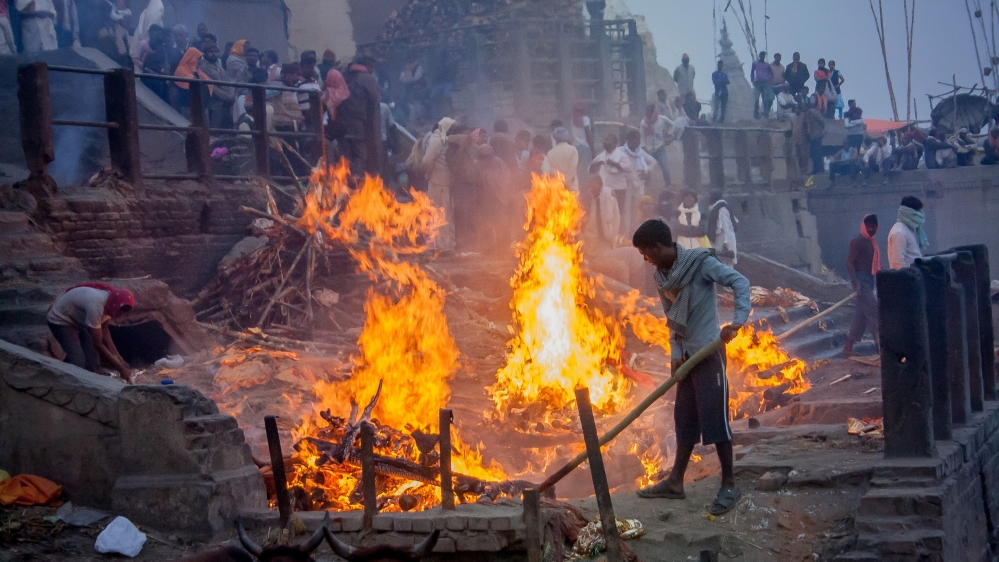 Yogi knows that if anything were to happen to his oldest brother Mithun, who works at Manikarnika Ghat, he would likely have to return there to earn money for his family. [Radhika Iyengar/Al Jazeera]
