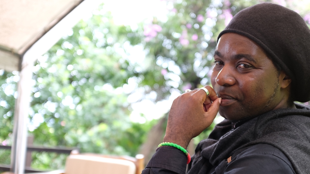 Hubert Furuguta, a local activist and artist running for elections for the first time [Sruthi Gottipati/Al Jazeera]