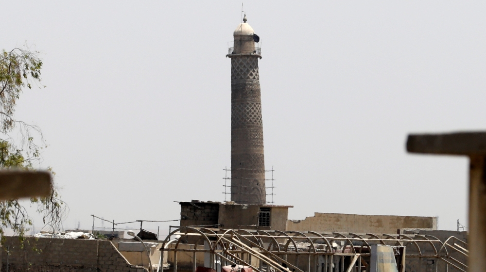 An Islamic State militants flag is seen on top of the minaret of al-Nuri mosque in the Old City in western Mosul