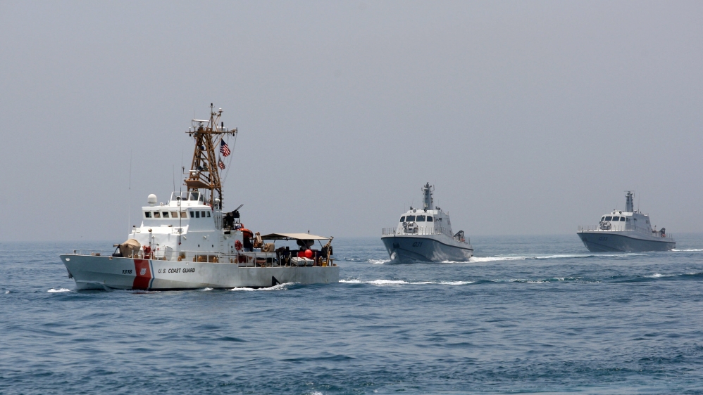 Military ships are seen during a naval exercise by US and Qatari troops in the Arabian Gulf