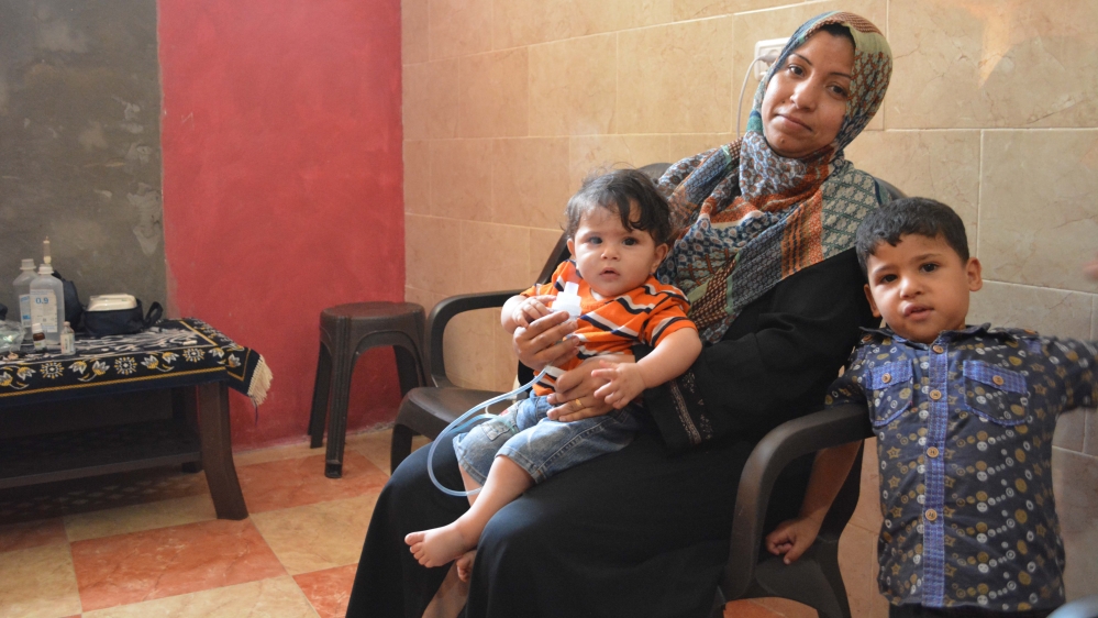 Riham Bahtiti's son's life depends entirely on the nebuliser, which requires electricity to run [Mersiha Gadzo/Al Jazeera]