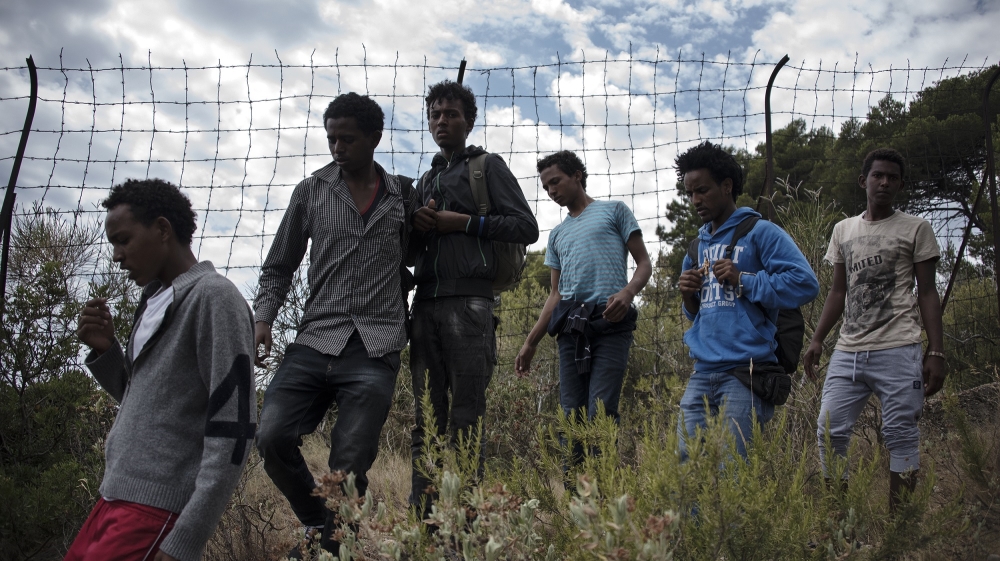 The wire fence separating Italy from France is only a small hindrance. The police on the other side are a more significant barrier [Maurizio Martorana/Al Jazeera]