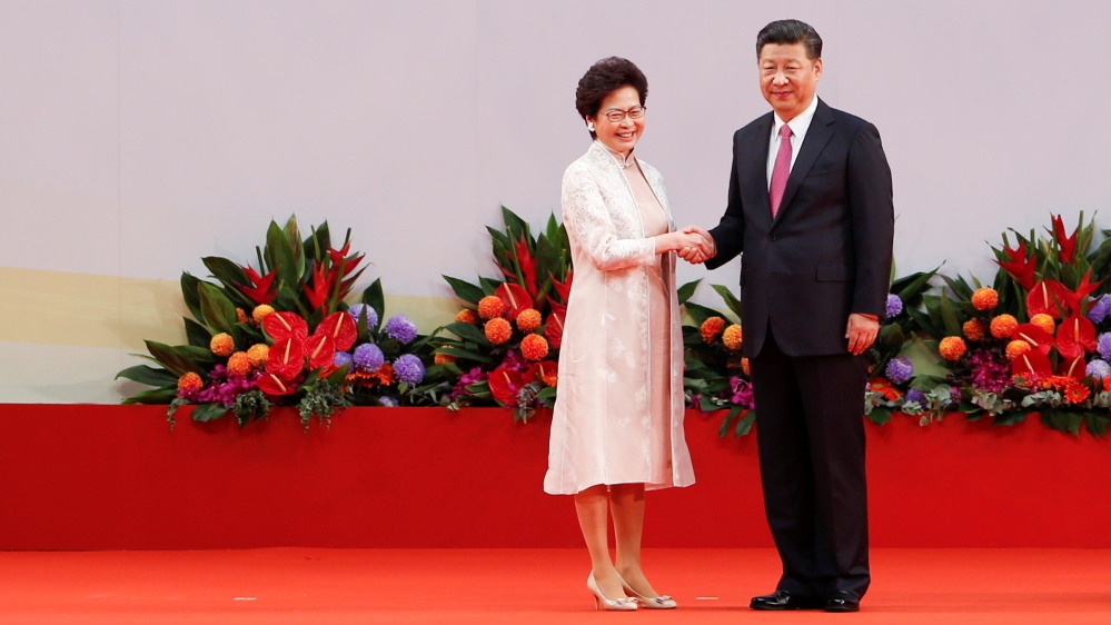 Hong Kong Chief Executive Carrie Lam shakes hands with Chinese President Xi Jinping after she swore an oath of office in Hong Kong