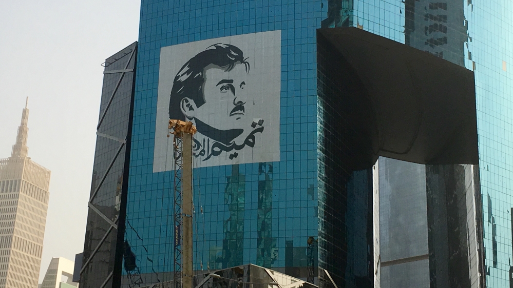 The longer the crisis drags on, the larger the portraits of the emir become [Cajsa Wikstrom/Al Jazeera]