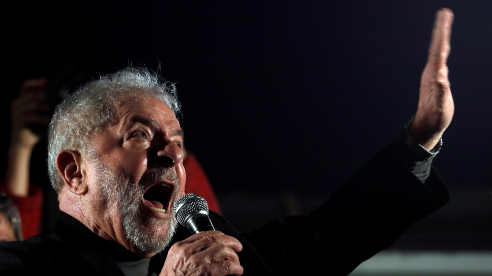 Former Brazilian President Luiz Inacio Lula da Silva gestures as he attends a protest against his conviction on corruption charges in Sao Paulo