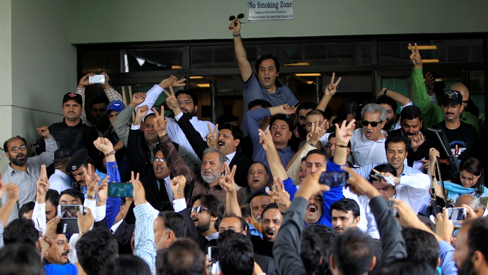 Sharif's shouted slogans as they exited the Supreme Court in Islamabad on Friday [Caren Firouz/Reuters]