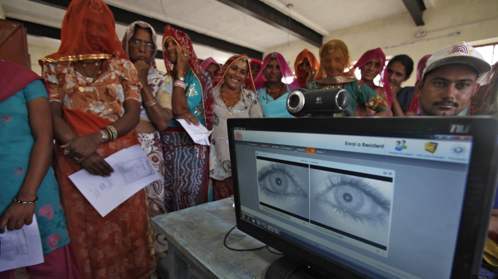Women stand in a queue to get themselves enrolled for government''s flagship biometric programme, Aadhaar