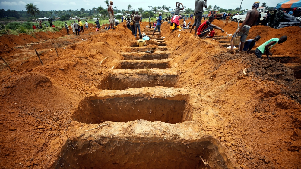 Workers are digging graves at the Paloko cemetery in Waterloo - Sierra Leone
