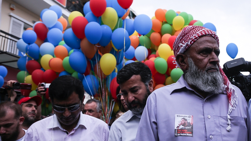 Hussein Luqman (right), Shahzad Luqman's father, attends the unveiling of monument for Pavlos Fyssas on September 18, 2014 [Nick Paleologos / SOOC/Al Jazeera] 