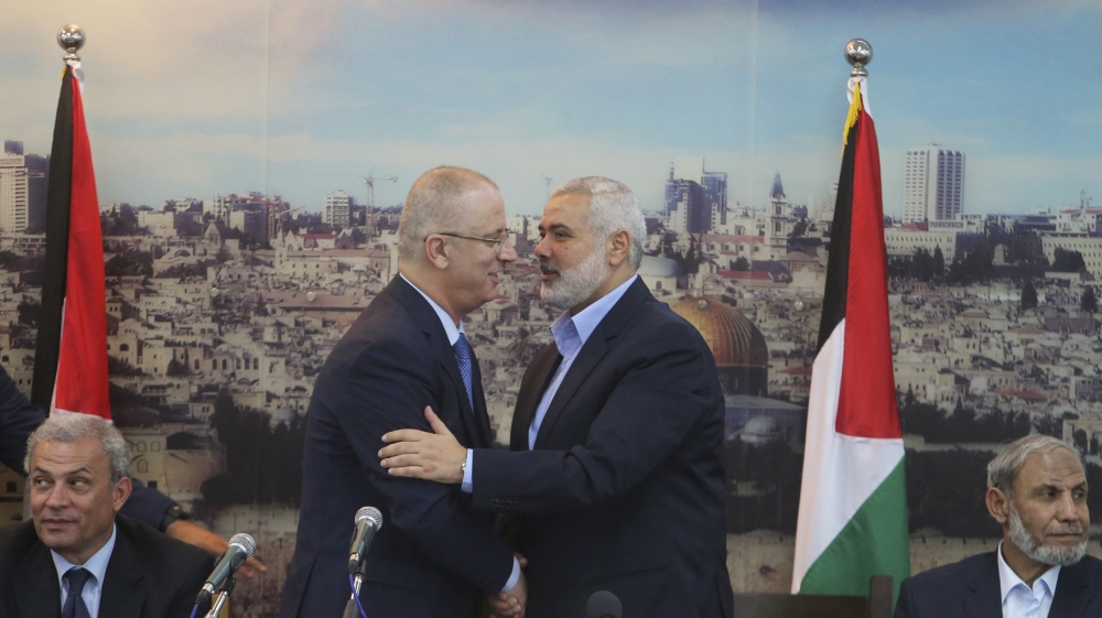 Senior Hamas leader Ismail Haniyeh shakes hands with Palestinian Prime Minister Rami Hamdallah at Haniyeh''s house in Gaza City