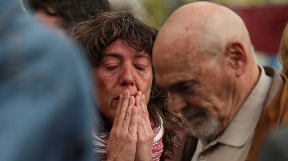 Supporters and family members of dismissed Catalan Cabinet members react outside Spain''s High Court in Madrid
