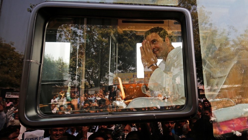 Rahul Gandhi, Vice-President of India''s main opposition Congress Party, greets his supporters during a rally ahead of Gujarat state assembly elections, at a village on the outskirts of Ahmedabad